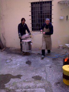 Once the Raku kiln is heated Enzo rushes to add the pots Once the Raku kiln is heated Enzo rushes to add the pots